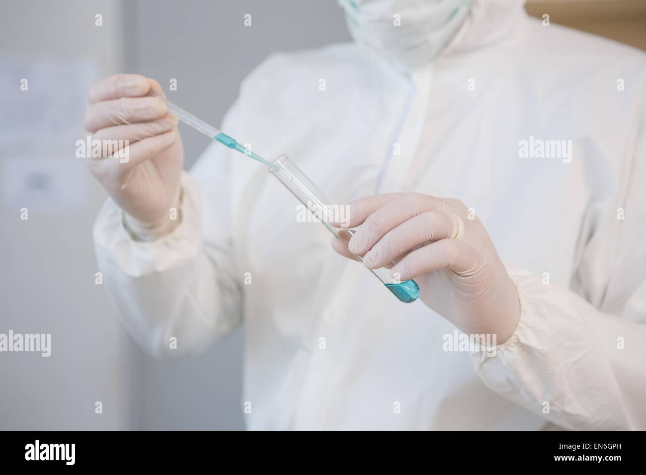 Scientist injecting tube Stock Photo