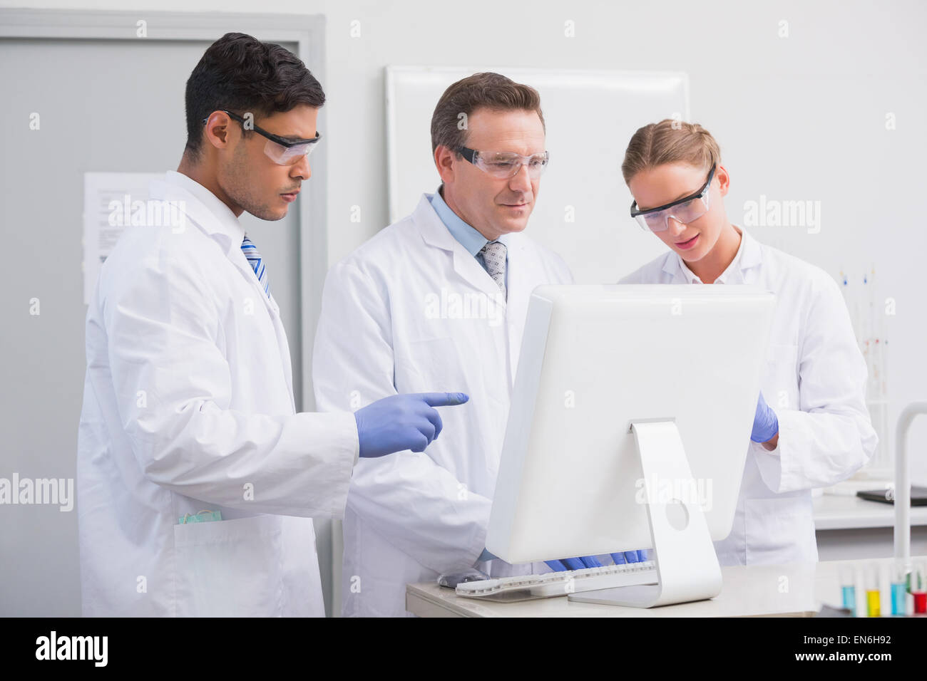 Scientists looking at computer Stock Photo - Alamy