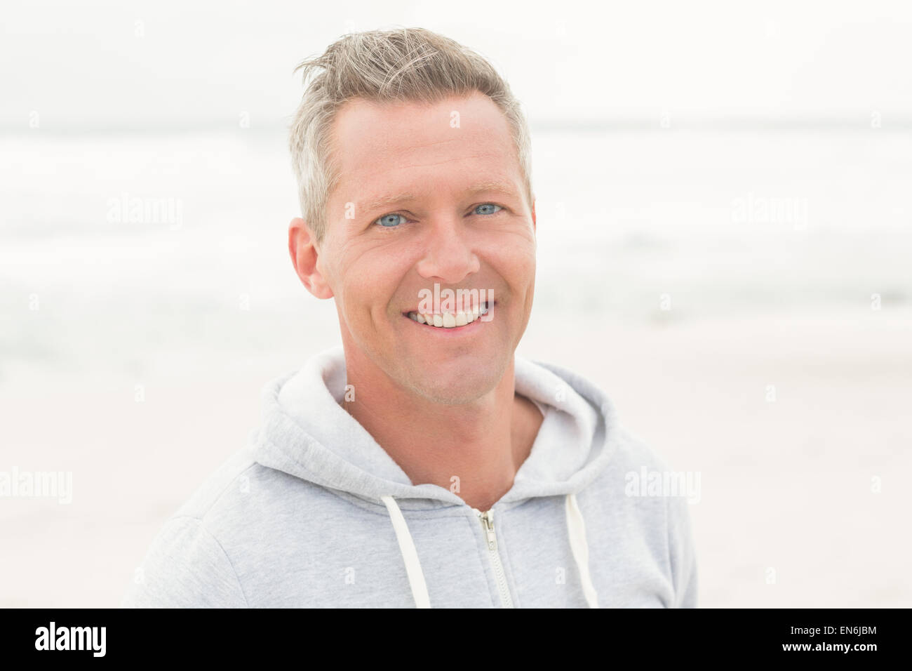 Casual man smiling at camera Stock Photo - Alamy