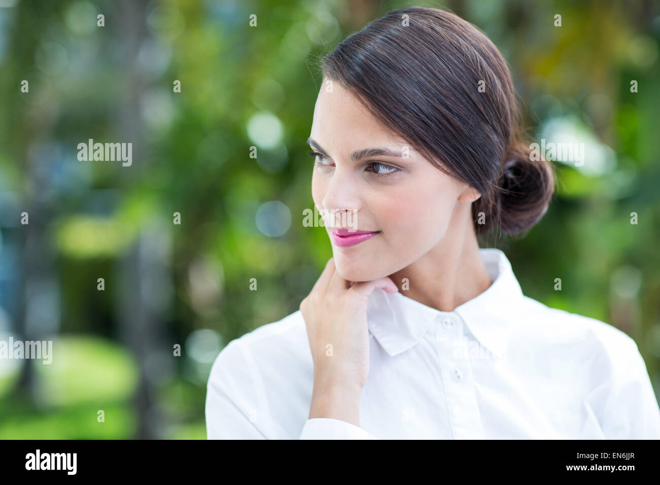 Thoughtful woman with hand on chin Stock Photo - Alamy