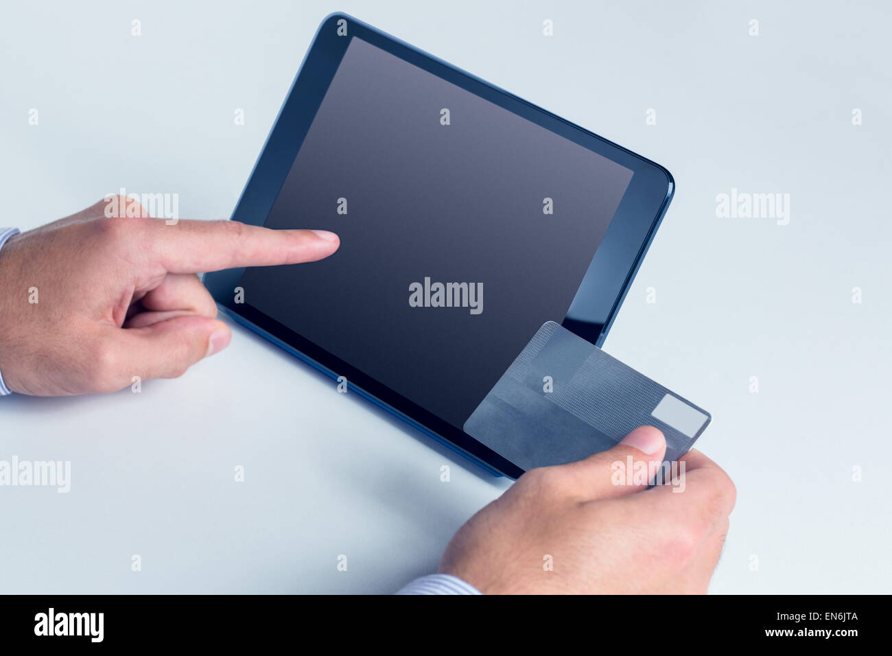 Man using tablet for online shopping Stock Photo - Alamy