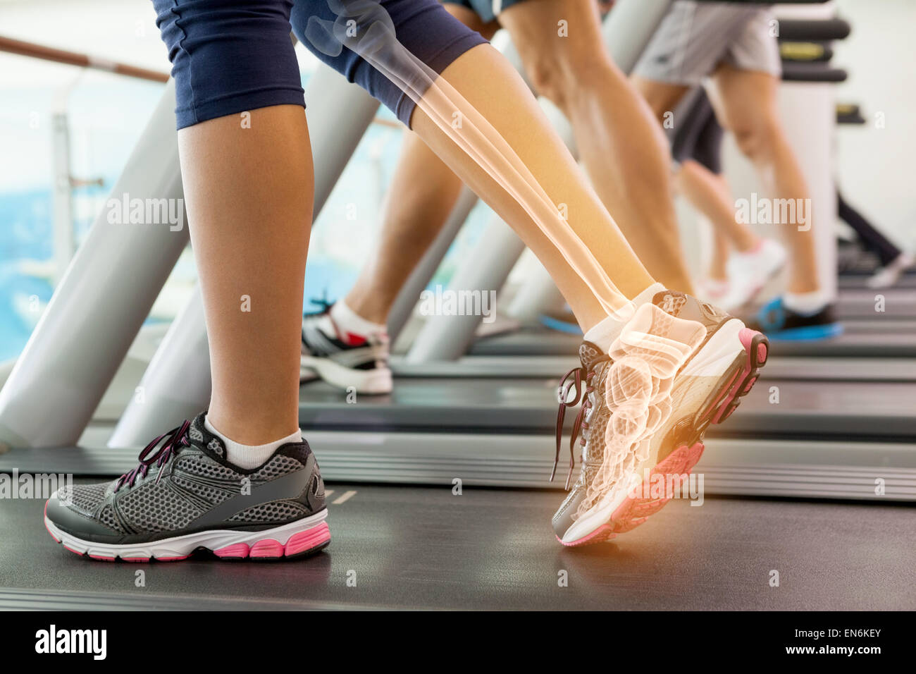 Highlighted ankle of woman on treadmill Stock Photo