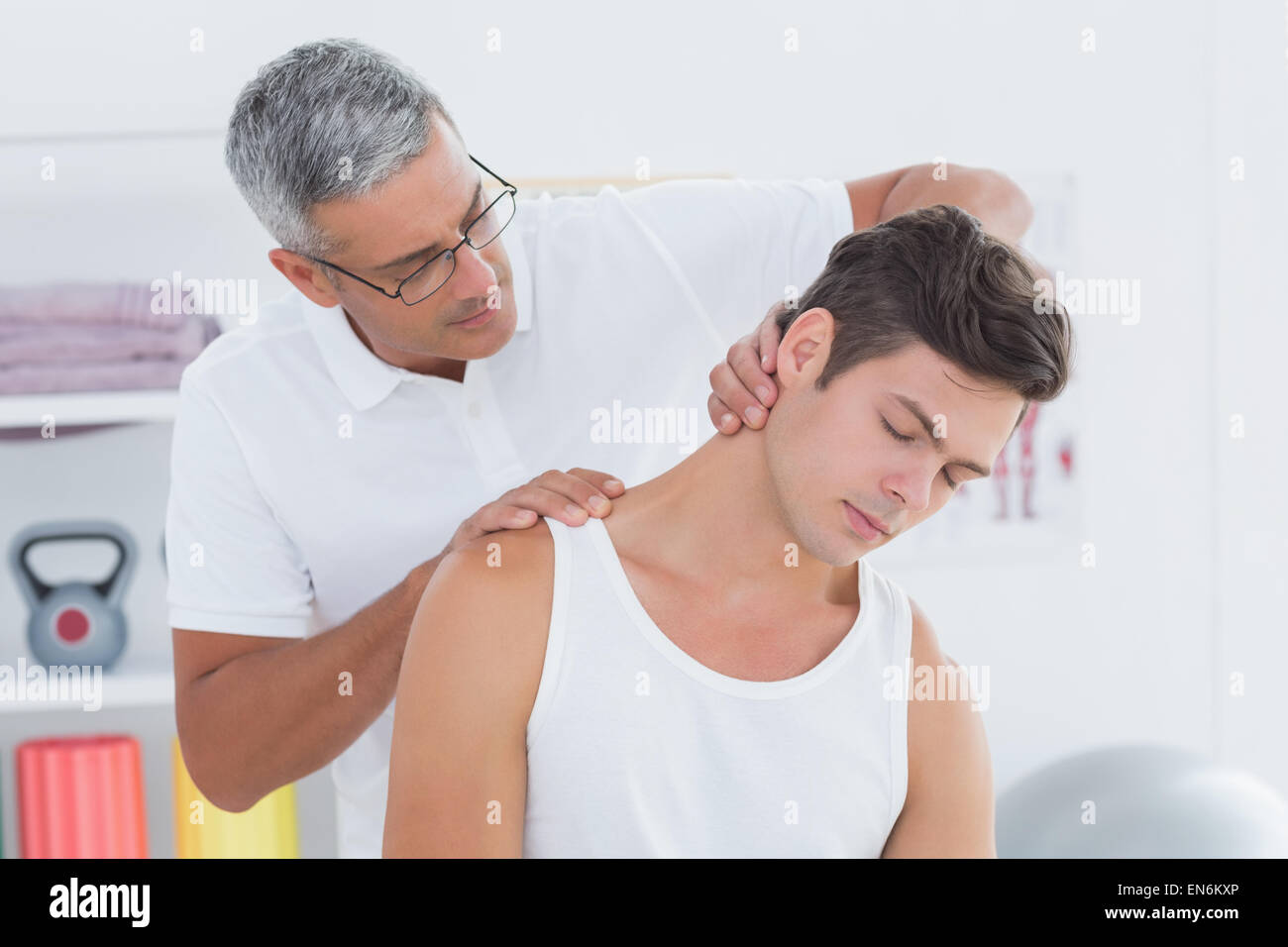 Doctor doing neck adjustment Stock Photo Alamy