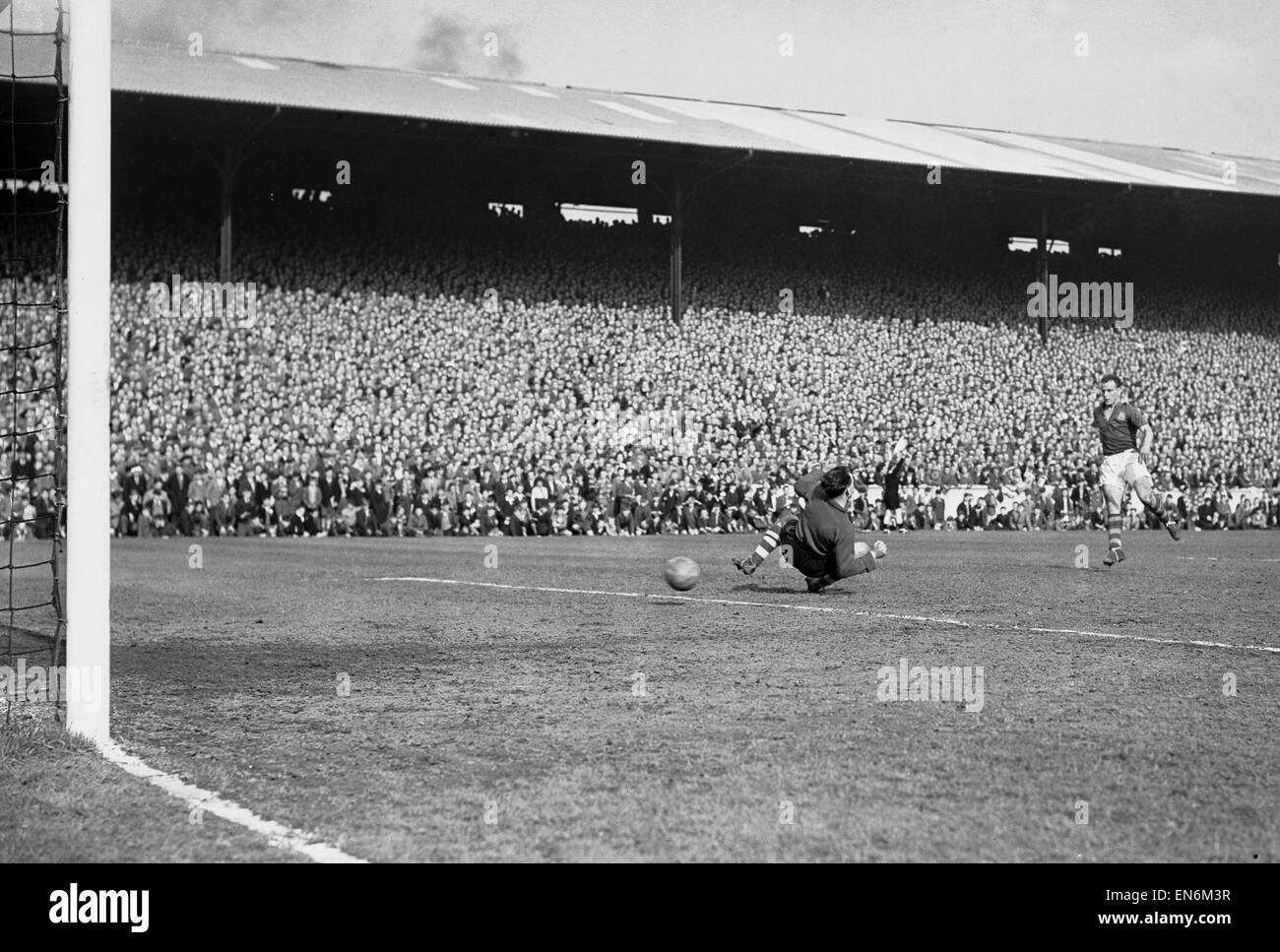 English League Division Two match at Elland Road. Leeds United 2 v Bristol Rovers 1. Leeds captain John Charles nets the ball past goalkeeper Radford from a pass by Overfield but the goal was disallowed for offside. 21st April 1956. Stock Photo