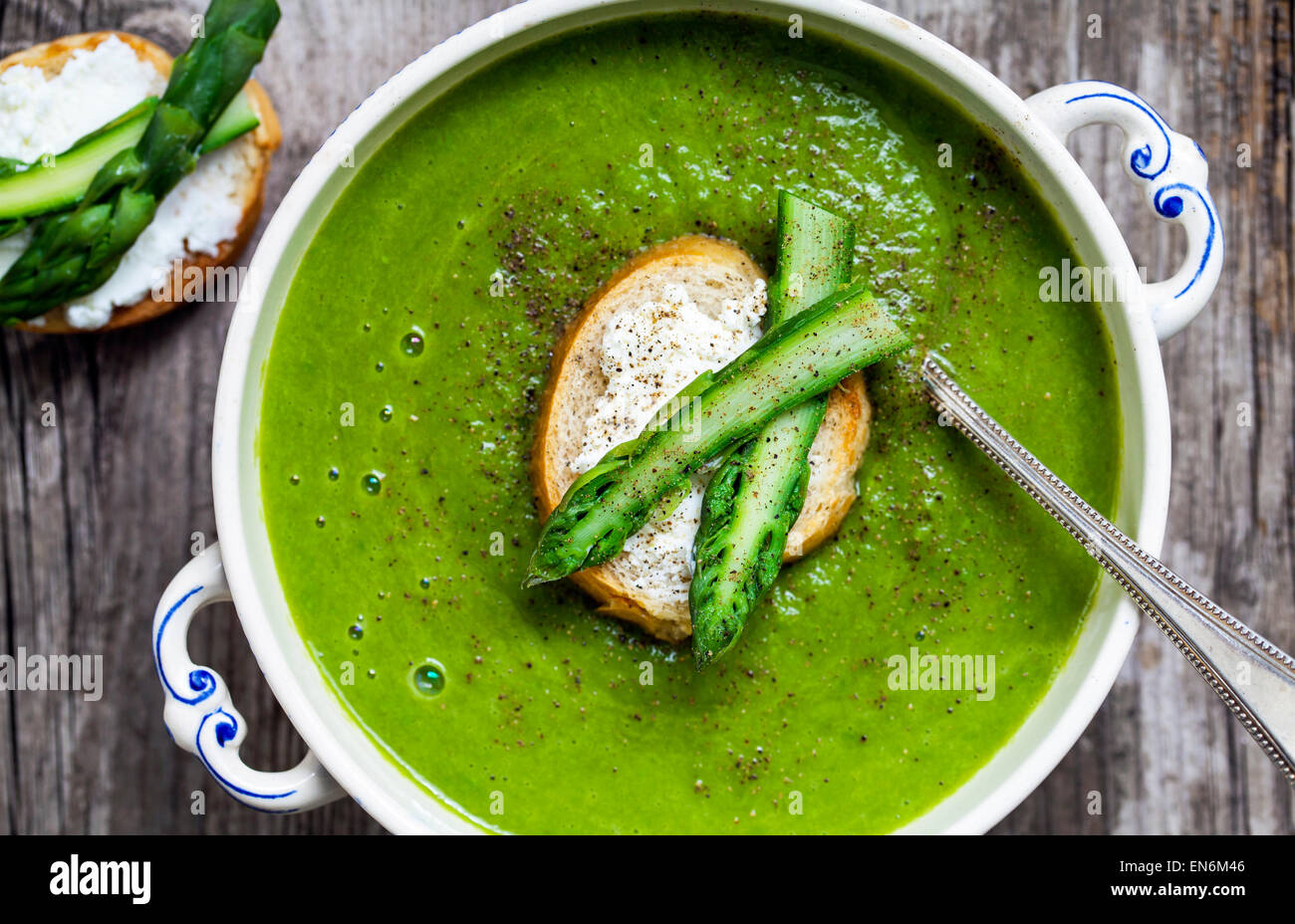 Asparagus soup with toast with goat cheese Stock Photo