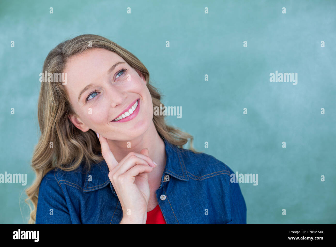 Smiling teacher standing in front of blackboard Stock Photo - Alamy