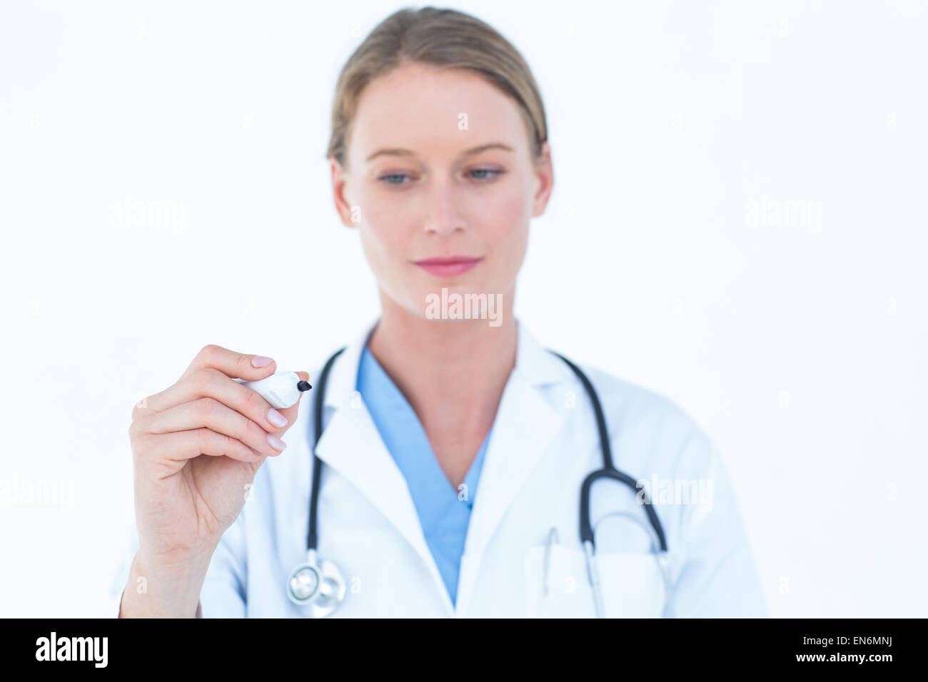 Young doctor writing with marker Stock Photo