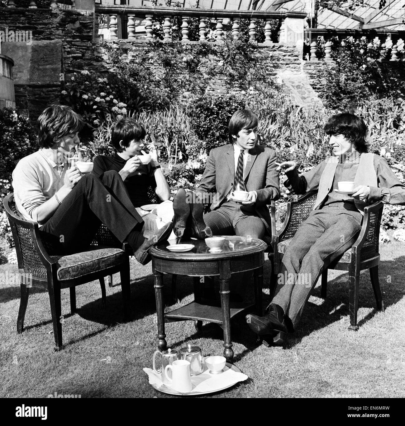 The Rolling Stones having a cup of tea in their hotel garden at Douglas,  Isle of Man 13th August 1964 Stock Photo - Alamy