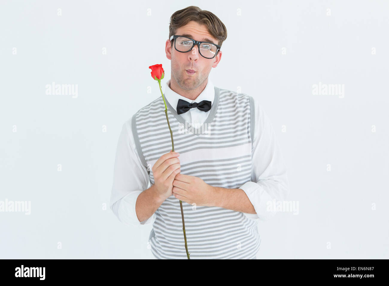 Geeky hipster holding a red rose Stock Photo - Alamy
