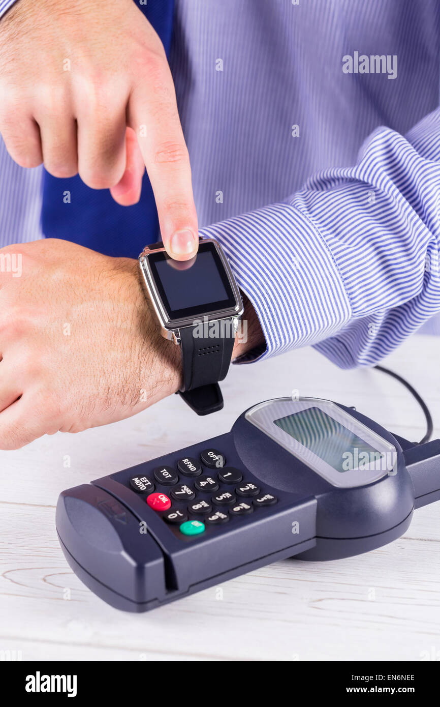 Man using smart watch to express pay Stock Photo