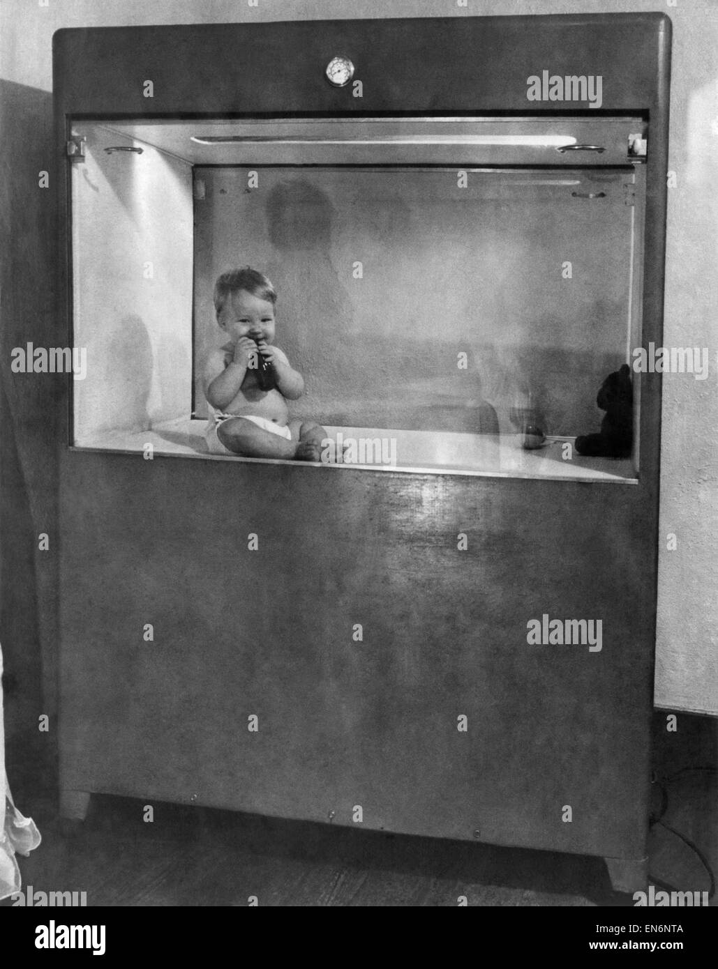 Baby lives in box. April 1948 Stock Photo