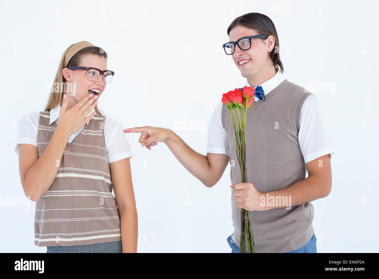 Geeky hipster offering red roses to his girlfriend Stock Photo - Alamy