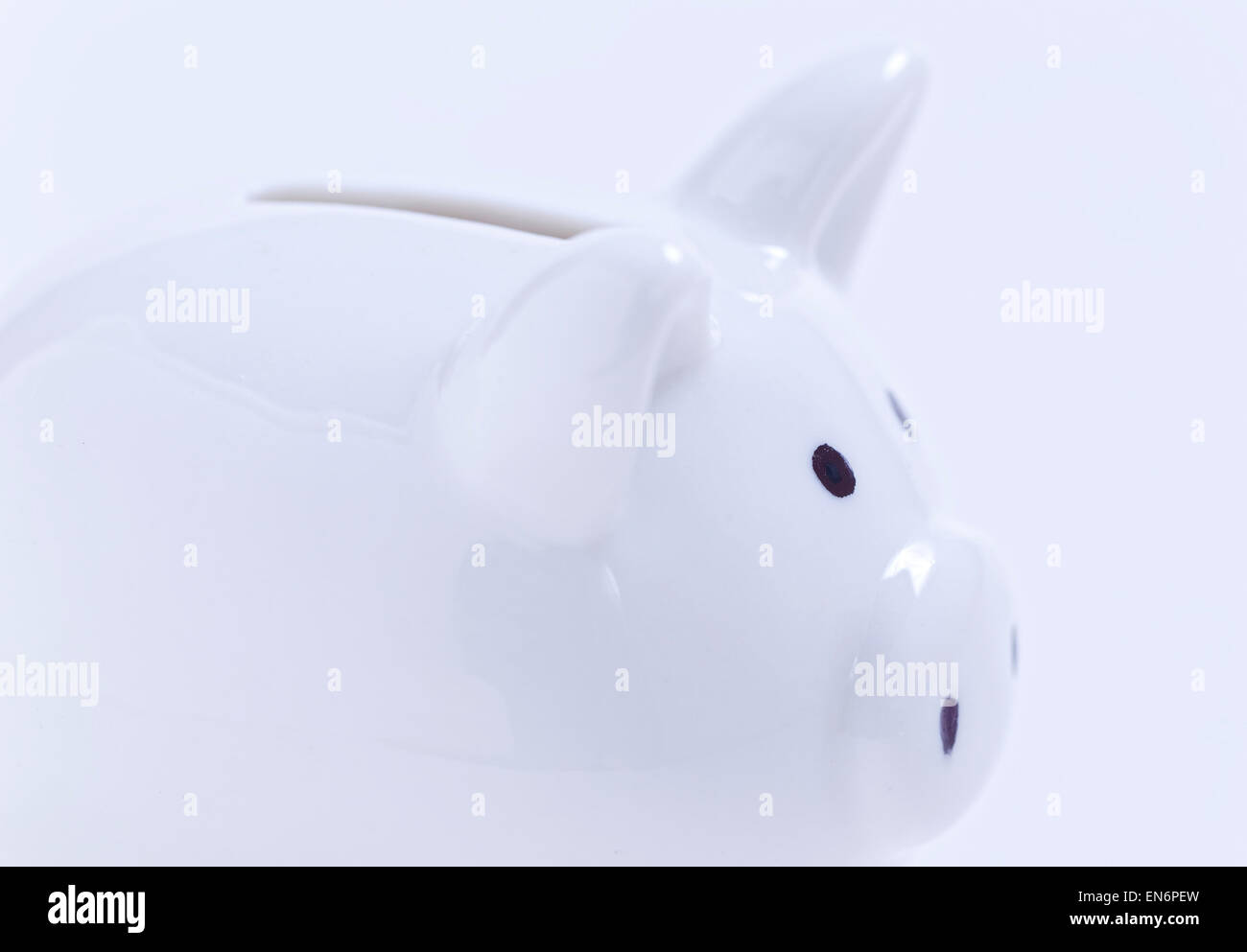 White piggy bank on white background Stock Photo - Alamy