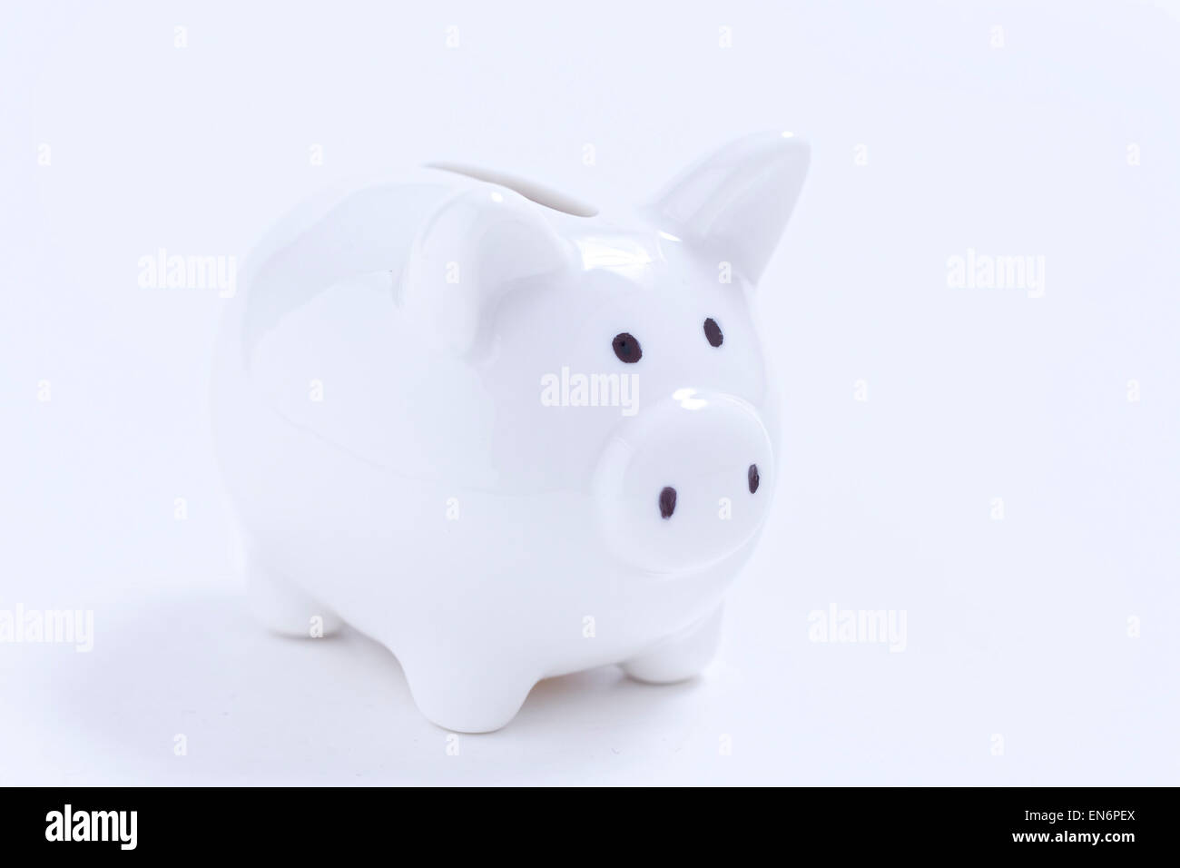 White piggy bank on white background Stock Photo - Alamy