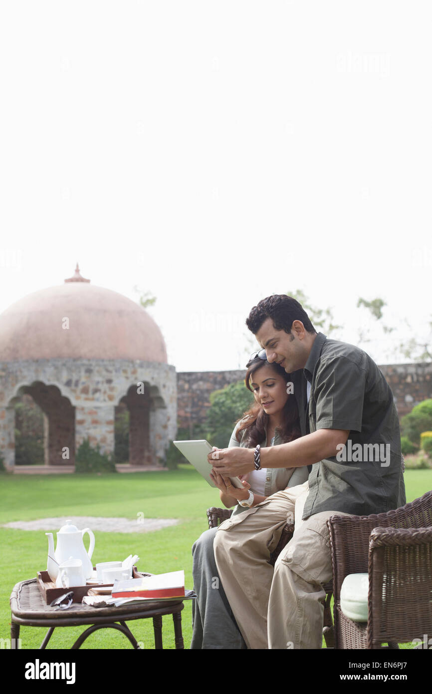 Couple relaxing outdoors Stock Photo