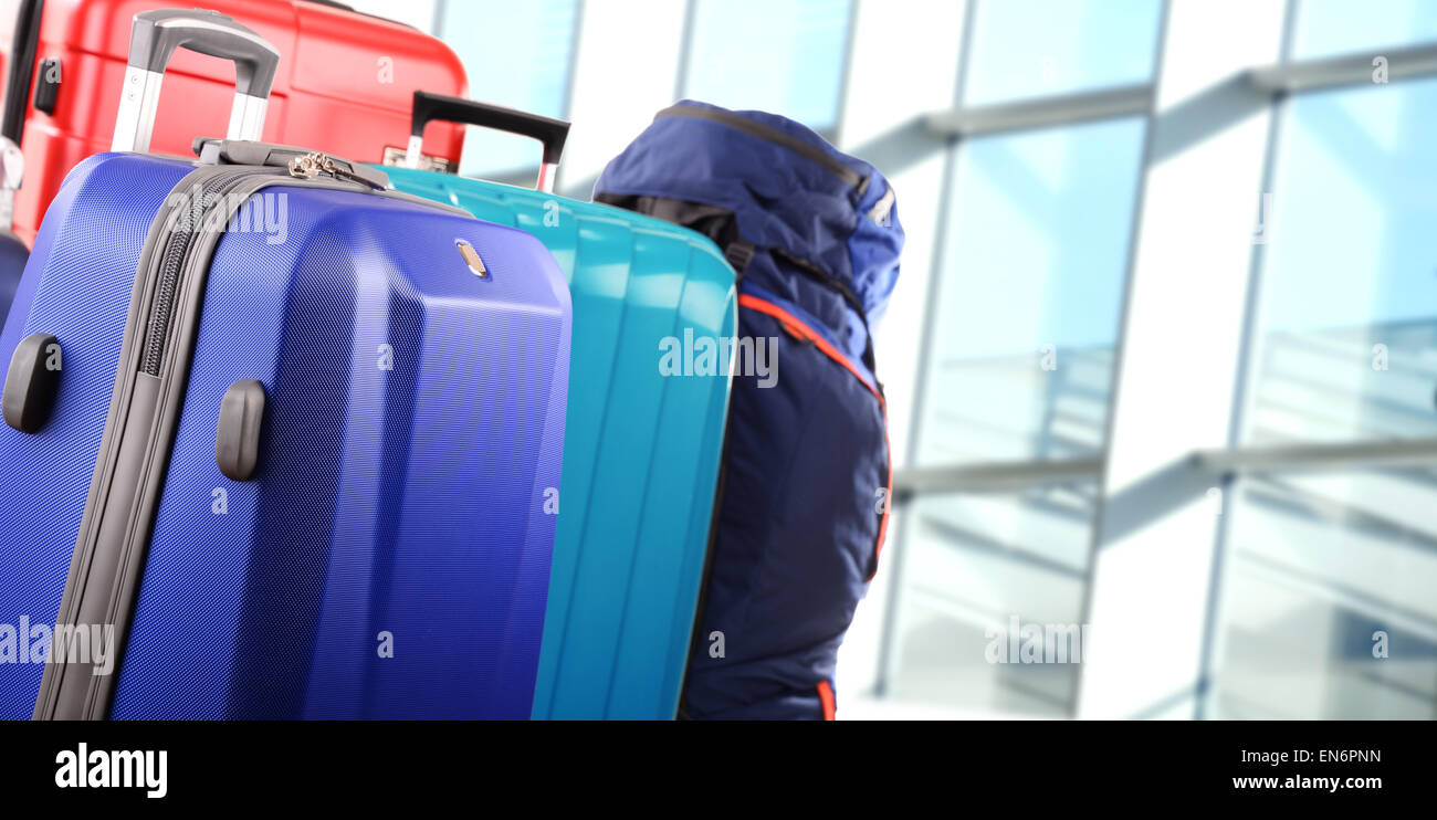Plastic travel suitcases in the airport hall Stock Photo Alamy