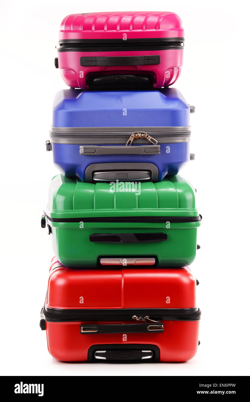 Stack of plastic suitcases isolated on white background Stock Photo