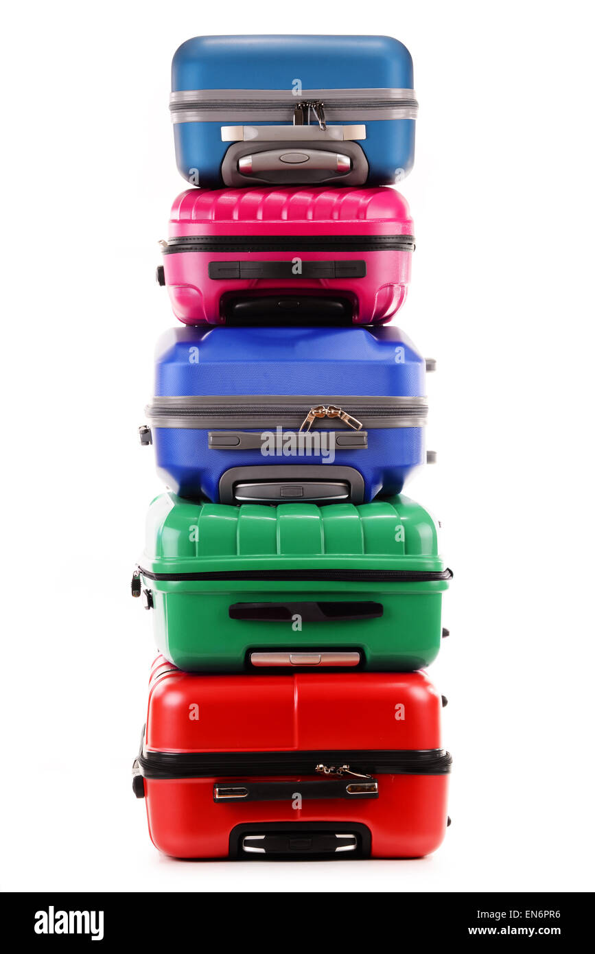 Stack of plastic suitcases isolated on white background Stock Photo