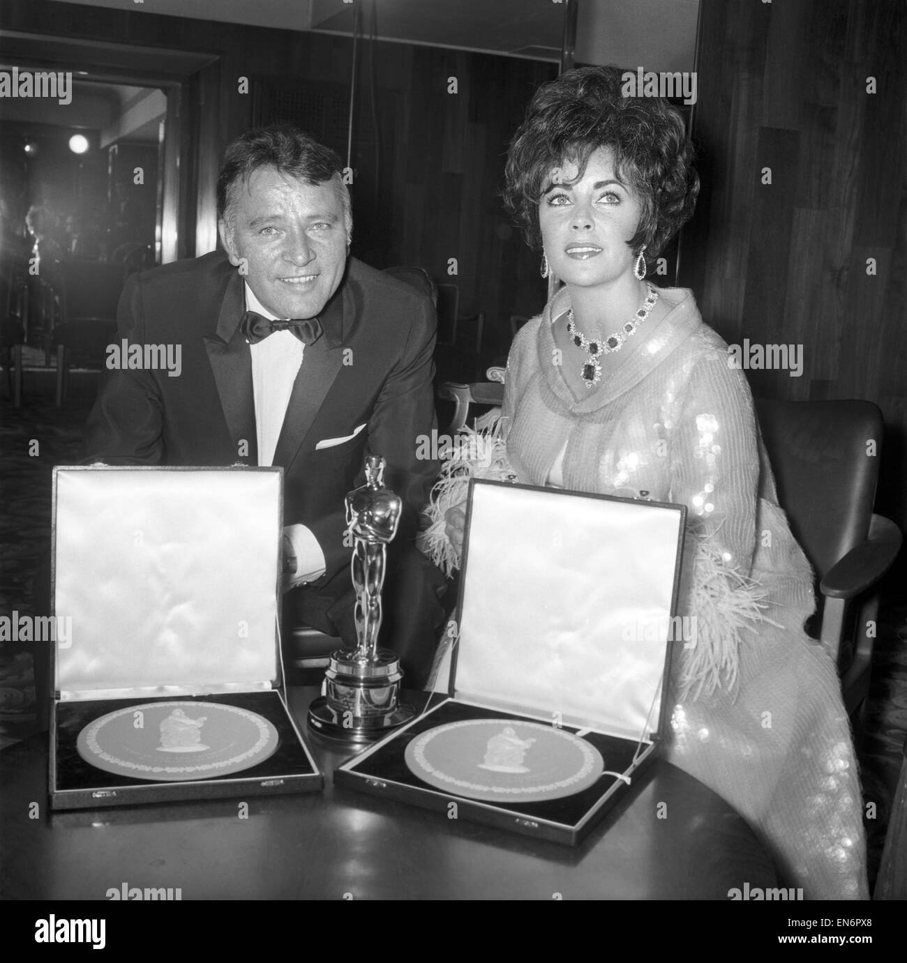 Richard Burton and Elizabeth Taylor seen here at film awards where Mrs.  Taylor received her oscar from Lord Mountbatten. Liz Taylor and Richard  Burton with their awards, for best actress and best