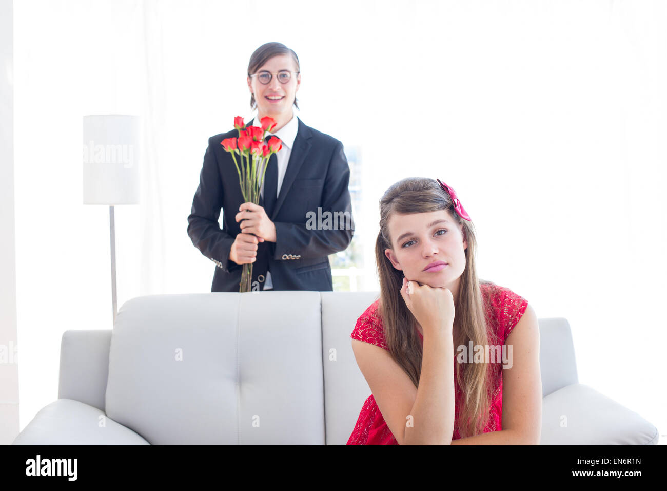 Geeky couple having an argue in the livingroom Stock Photo