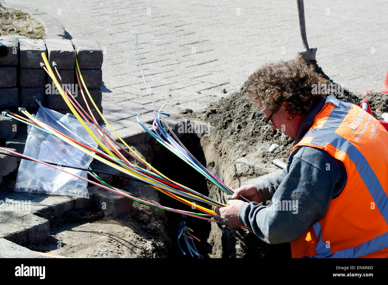 Men laying optical fiber cables Stock Photo Alamy