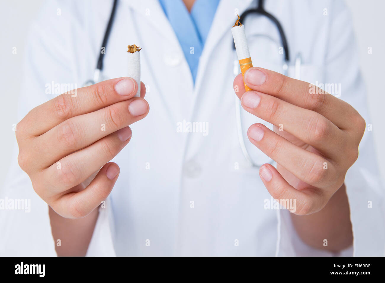 Doctor breaking cigarette Stock Photo