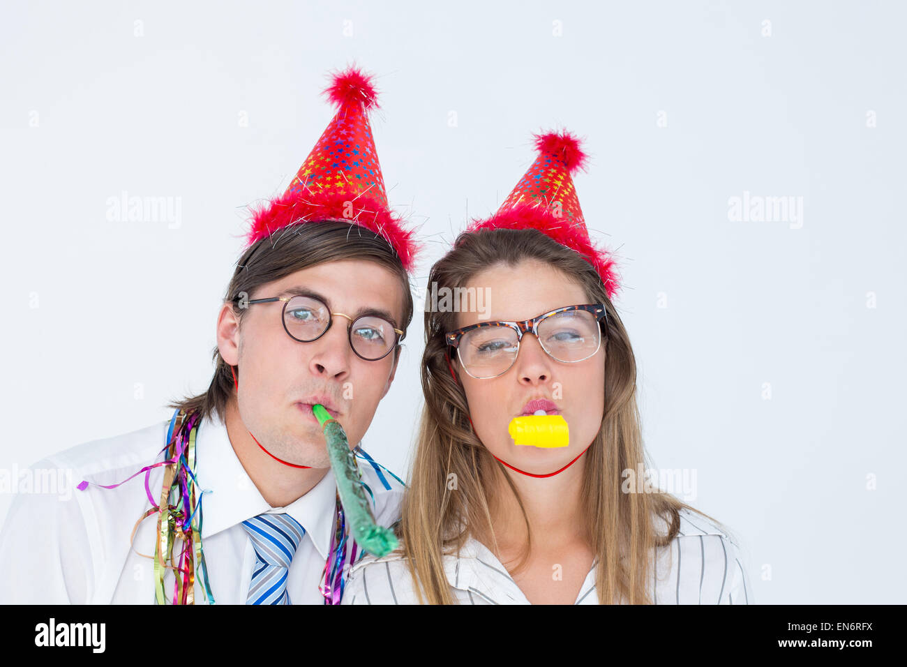 Young woman blowing party horn hi-res stock photography and images - Alamy
