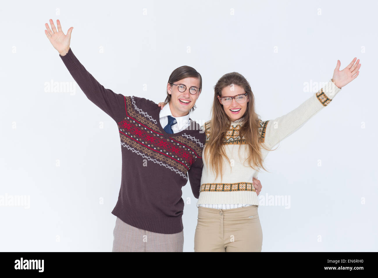 Happy geeky hipster couple embracing Stock Photo