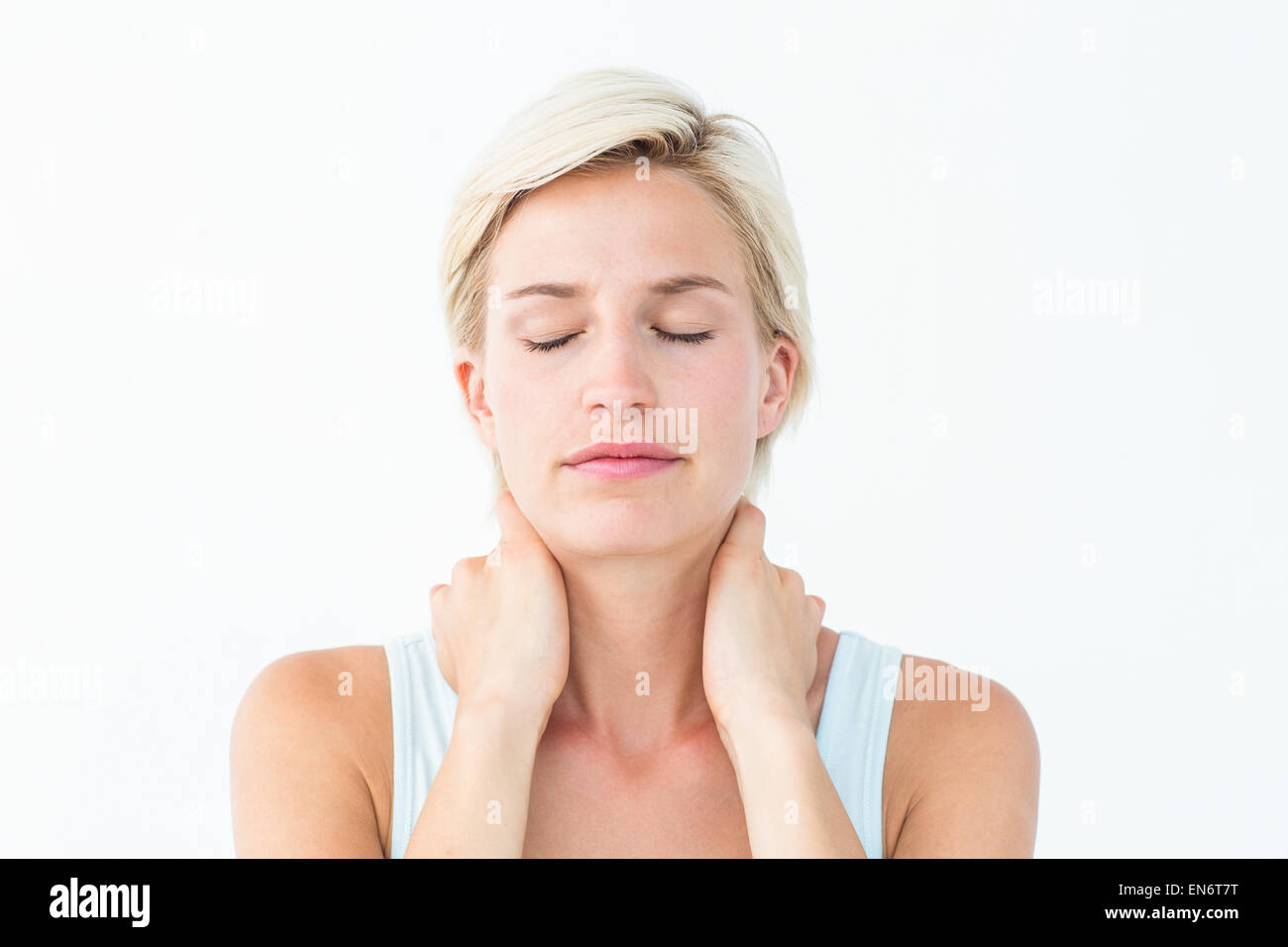 Woman massaging neck eyes closed hires stock photography and images