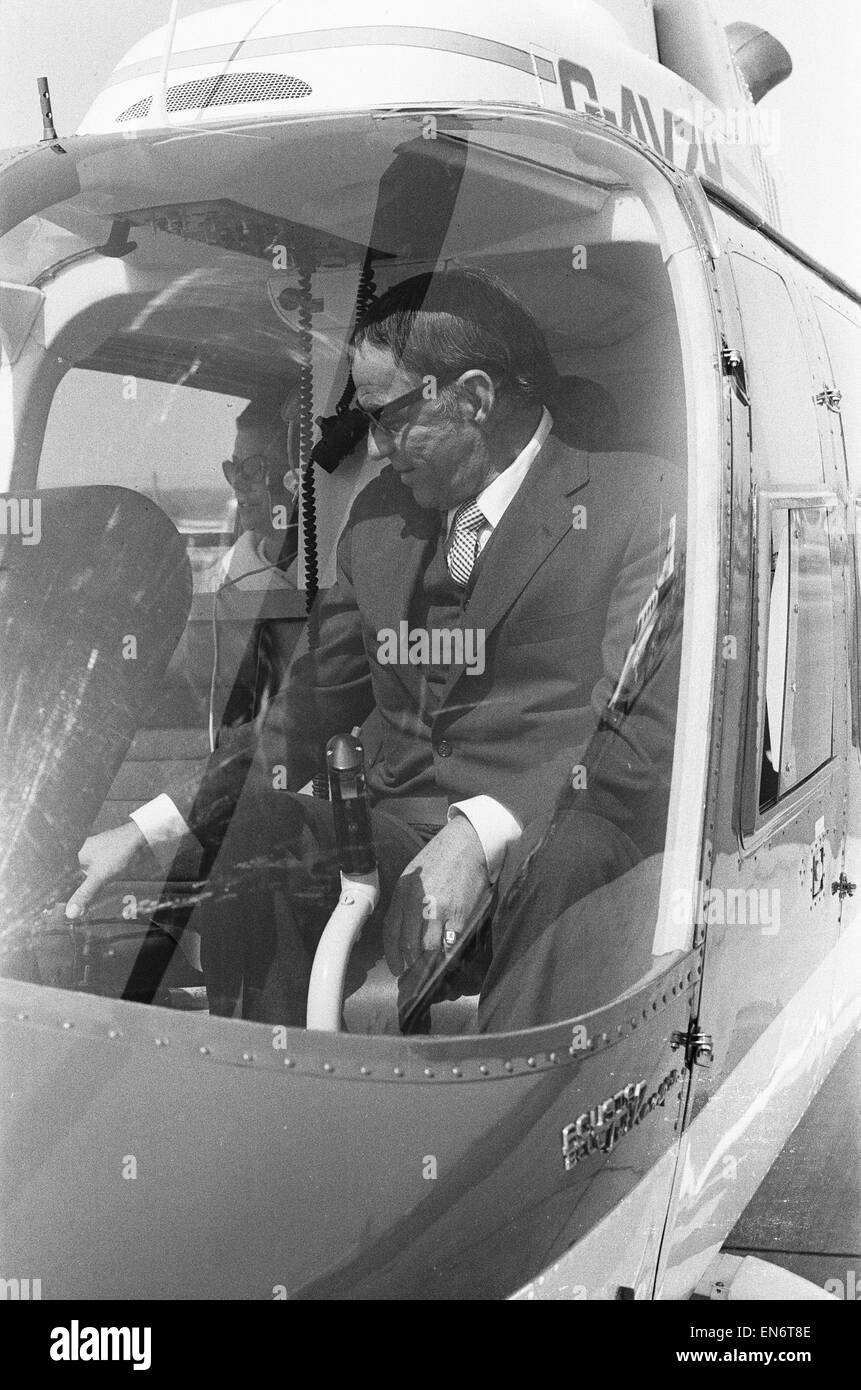 Singer Frank Sinatra who is in the United Kingdom to perform two charity concerts in aid of childrens charities. Is seen here in a Bell Jet Ranger helicopter at Gatwick Airport, shortly after arriving in his private jet. Sinatra took the short flight from Stock Photo