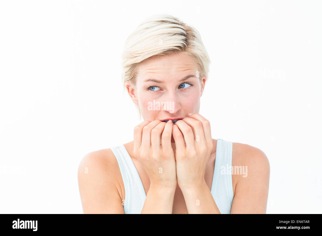 Nervous woman biting her nails Stock Photo
