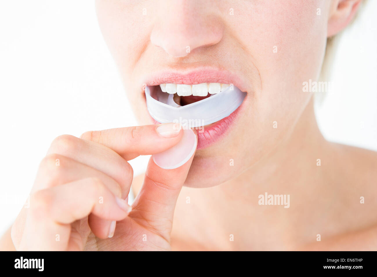 Woman putting her gum shield Stock Photo