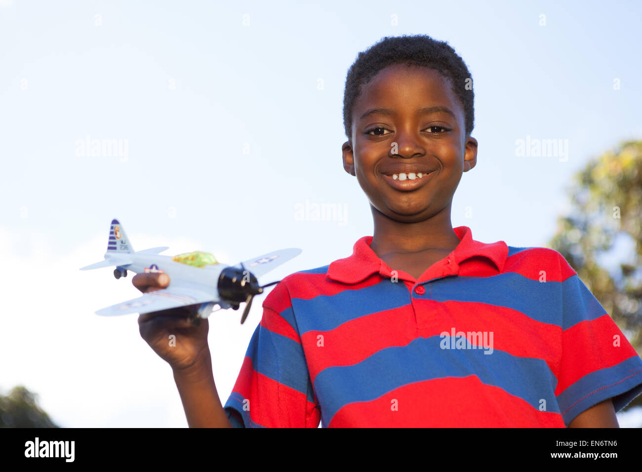 Little boy playing with toy airplane Stock Photo - Alamy
