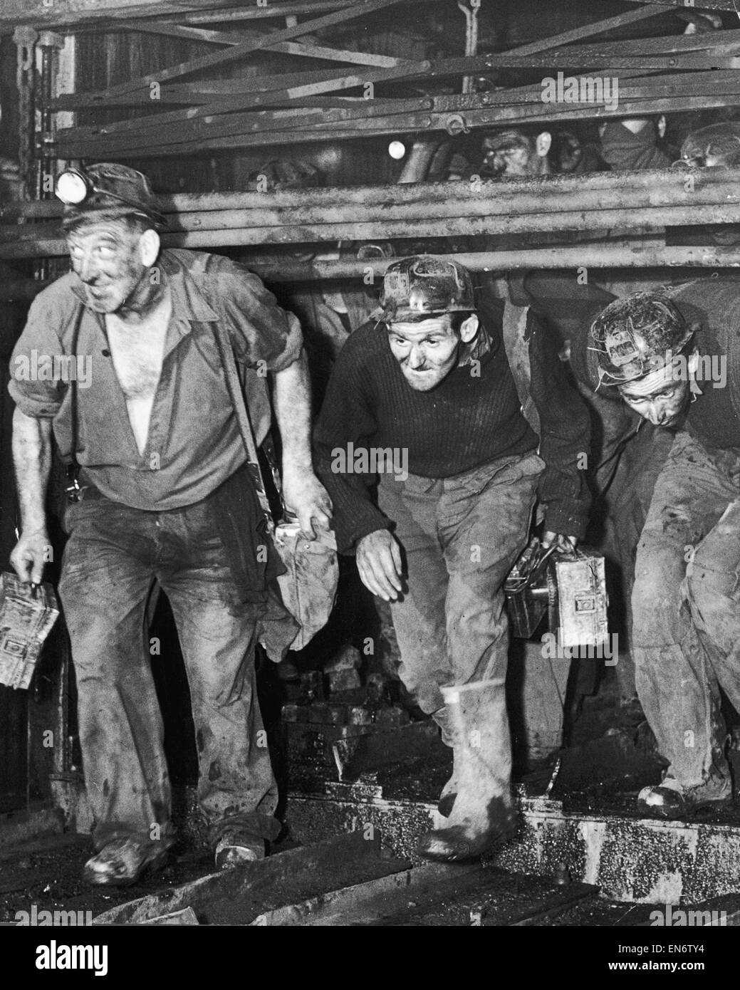 Miners coming off shift at the end of a hard day at the coal face. Circa 1960s Stock Photo
