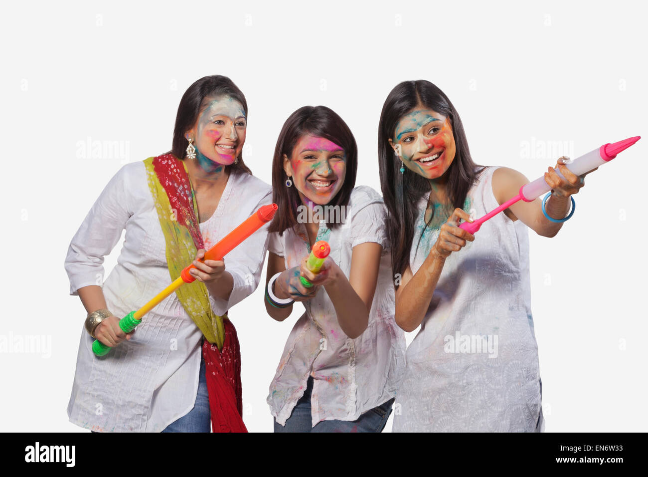 Three women playing holi Stock Photo