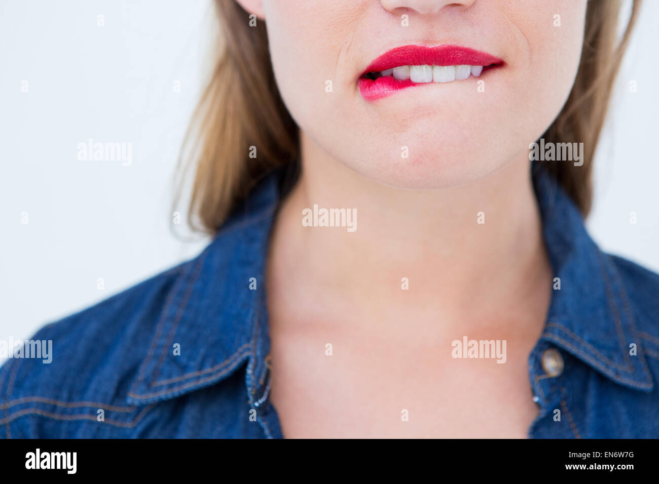 Woman biting her lip Stock Photo