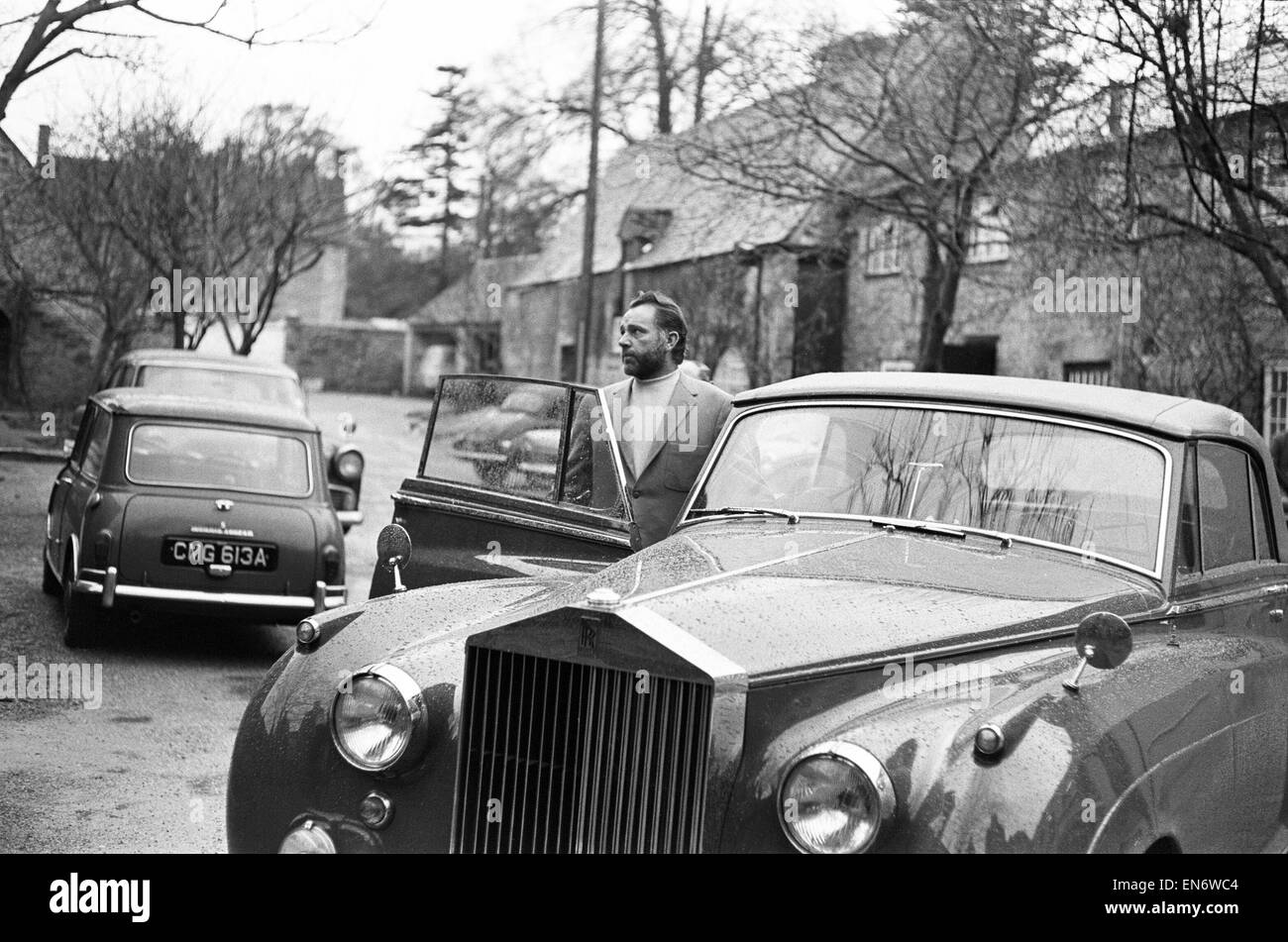 Richard Burton and Elizabeth Taylor visiting Merton College, Oxford, to  discuss the production of 'Mr Faustas' in which they are both to star for  free. OPS Burton getting into his Rolls Royce.