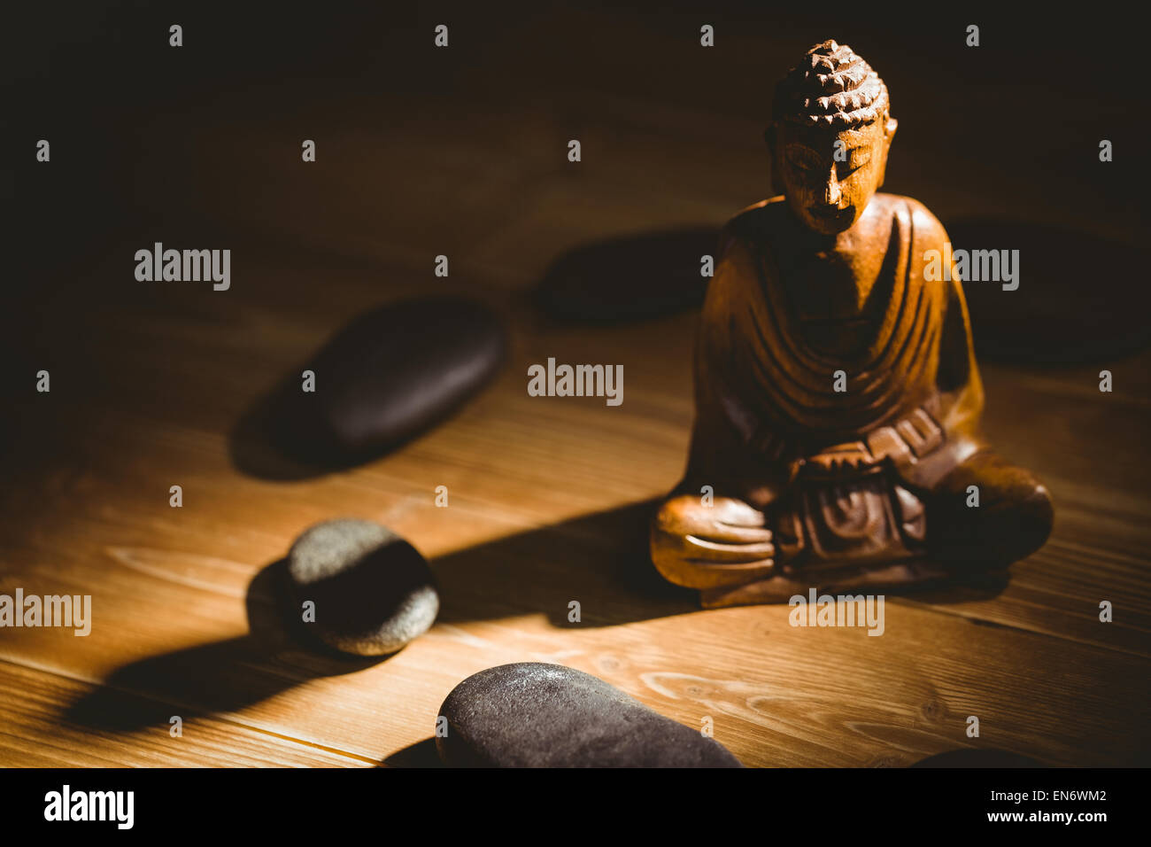 Wooden buddha statue on table Stock Photo Alamy