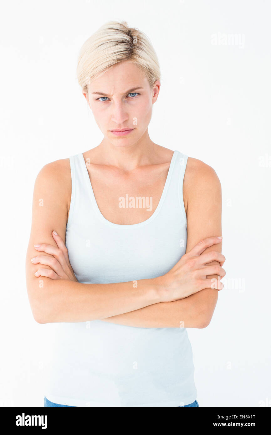 Upset blonde looking at camera with arms crossed Stock Photo Alamy