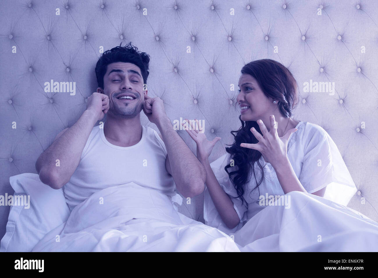 Couple arguing in bed Stock Photo