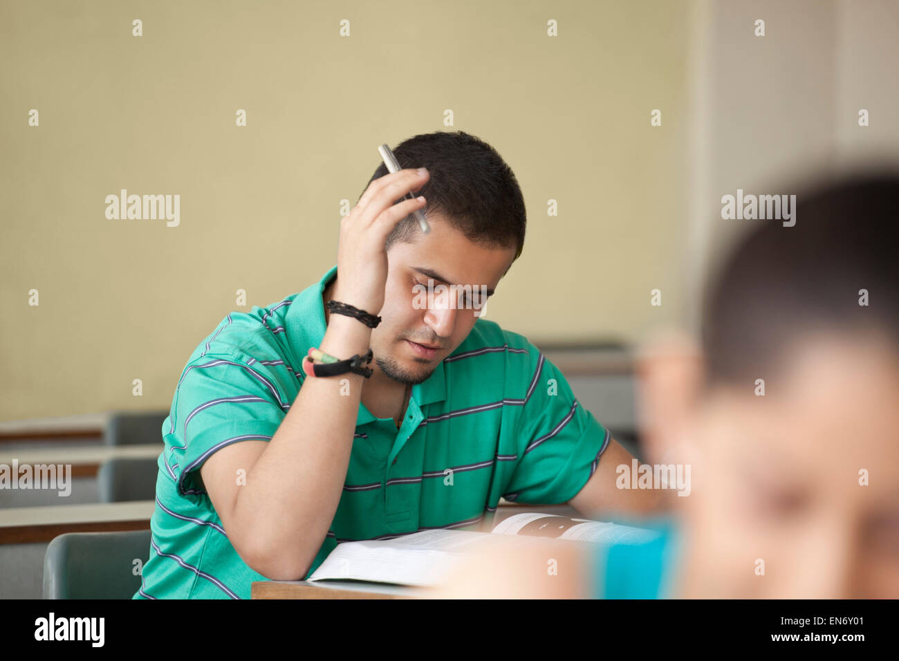 Professor holding a digital tablet while teaching Stock Photo
