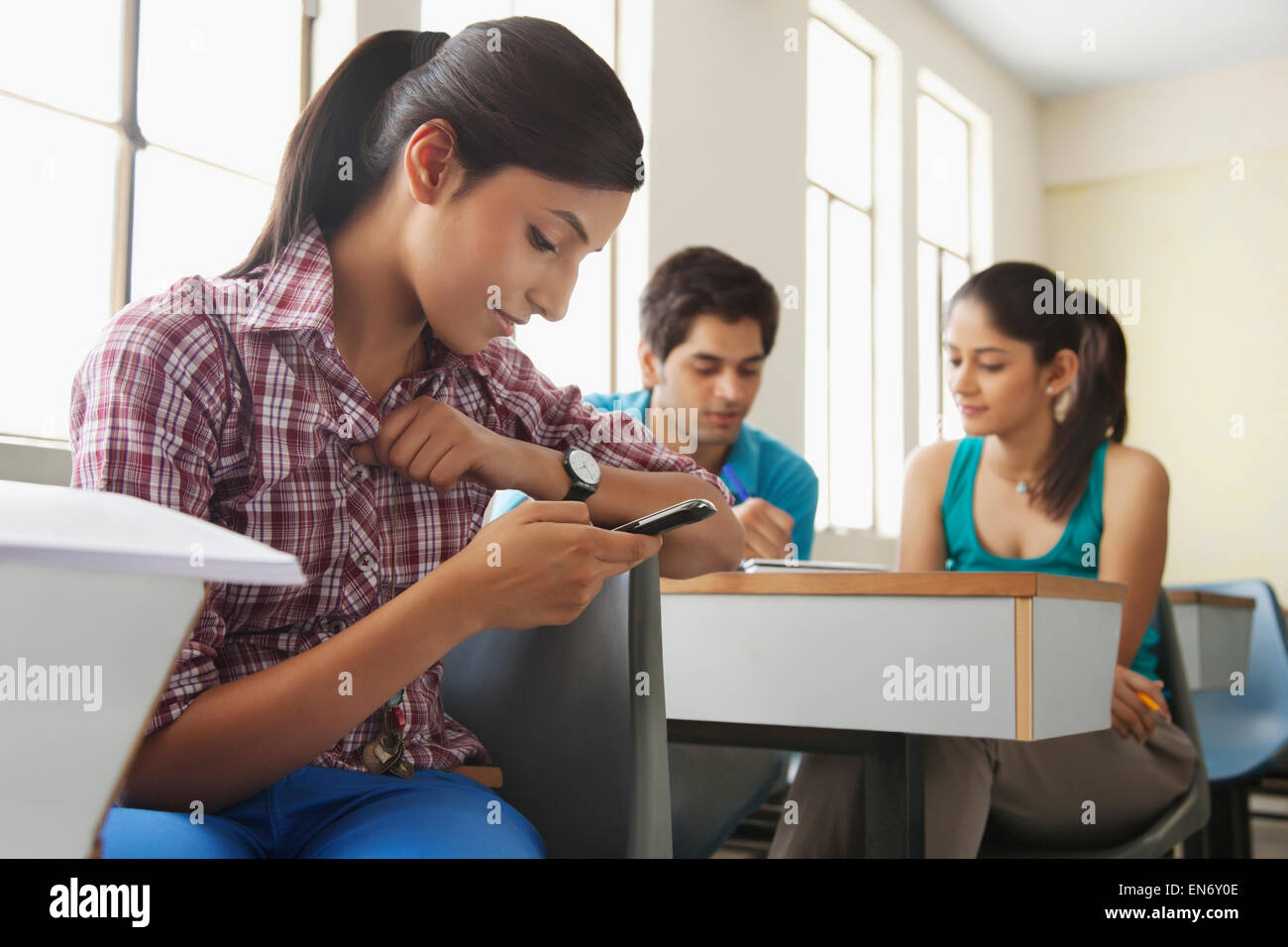College student daydreaming in classroom Stock Photo