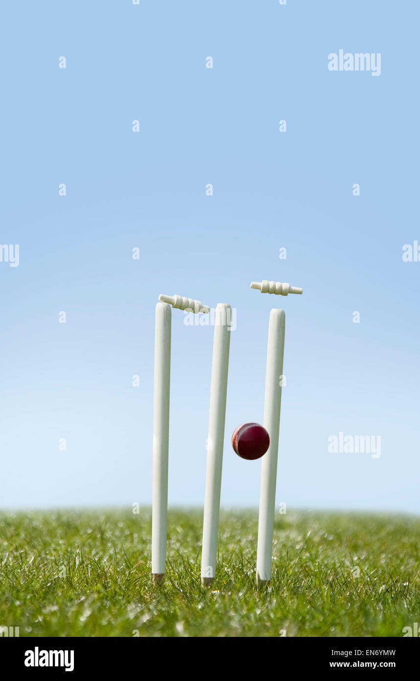 Cricket ball hitting the wicket Stock Photo