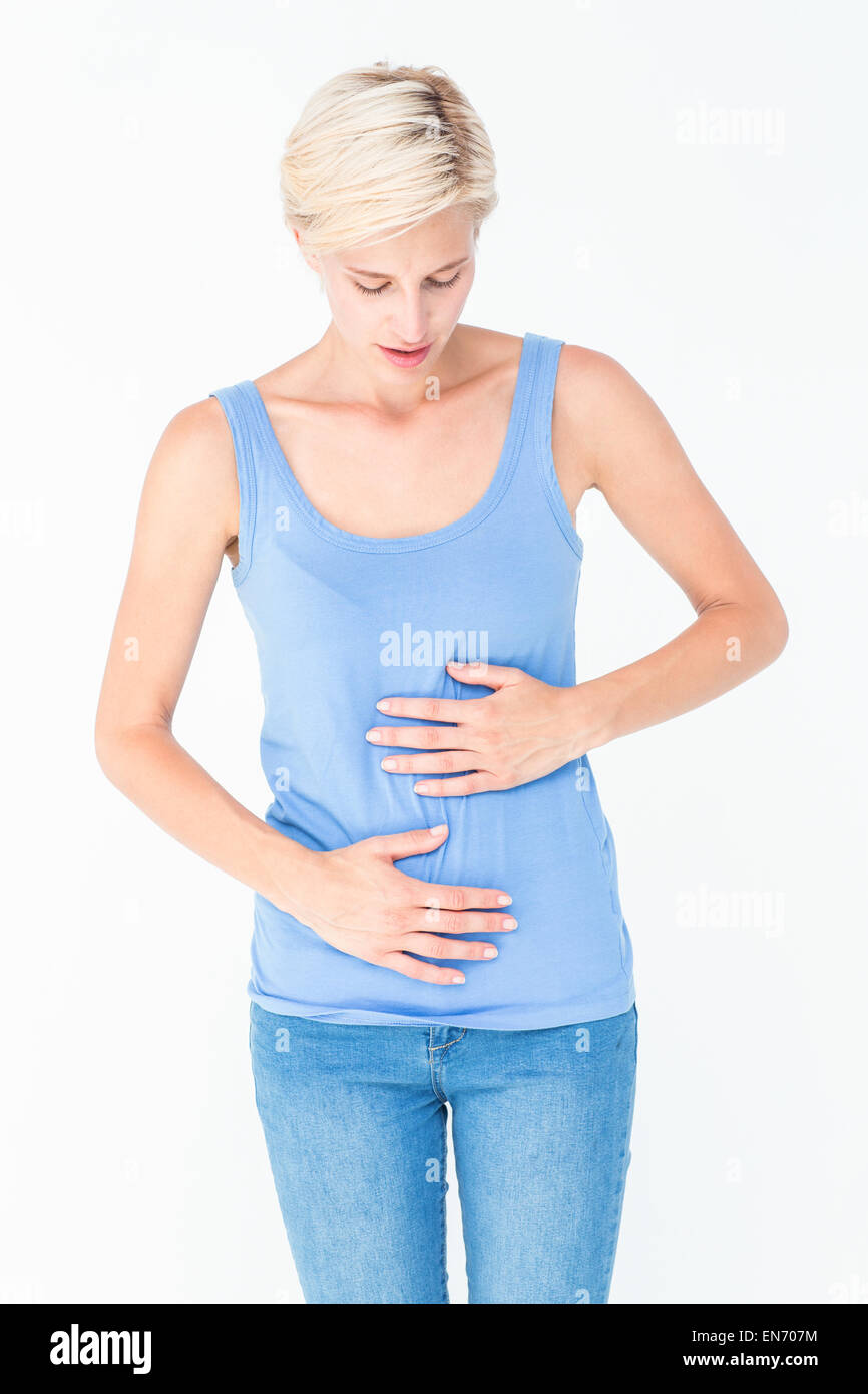 Casual woman with stomach pain Stock Photo Alamy