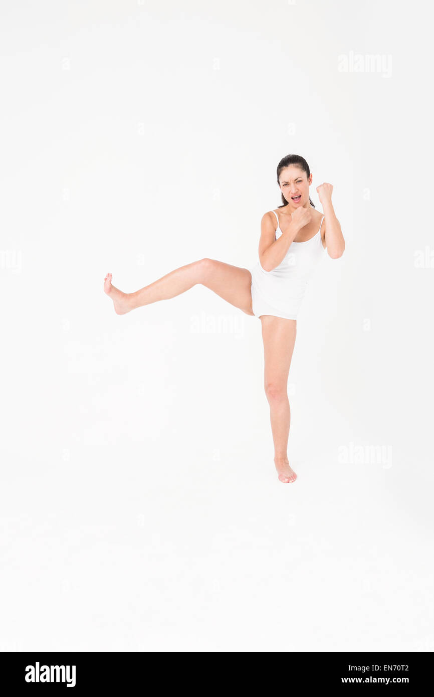 Fit woman practicing karate Stock Photo