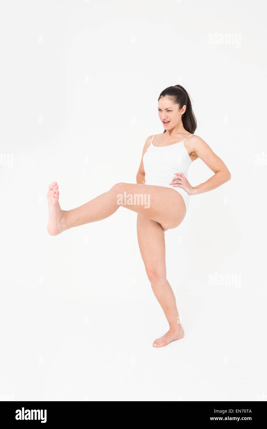 Fit woman practicing karate Stock Photo
