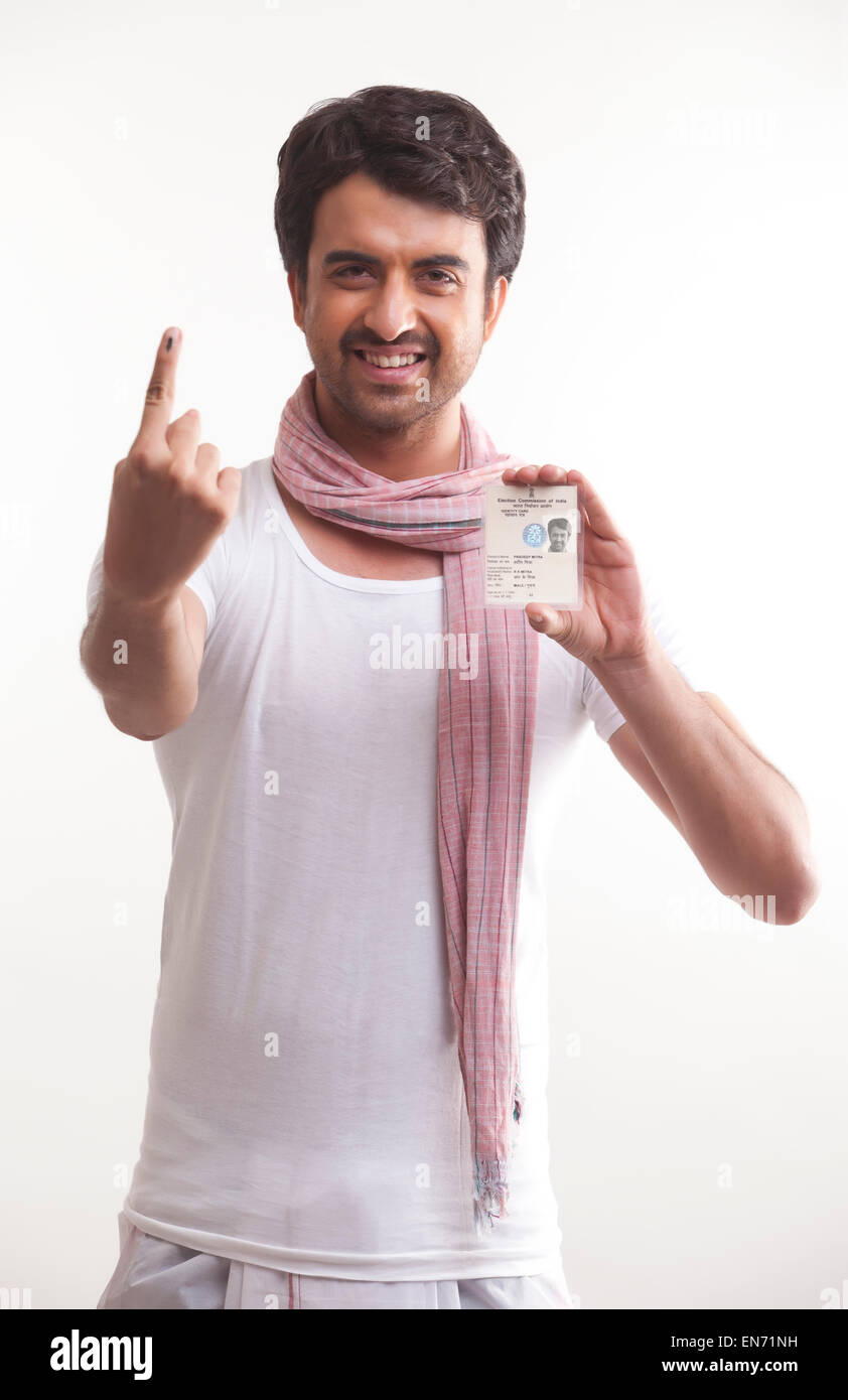 Farmer with voters mark and identity card Stock Photo - Alamy