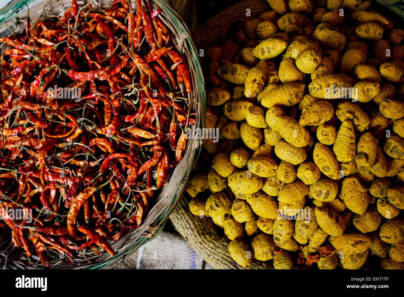 Dried chillies and turmeric root for sale at the market Stock Photo Alamy