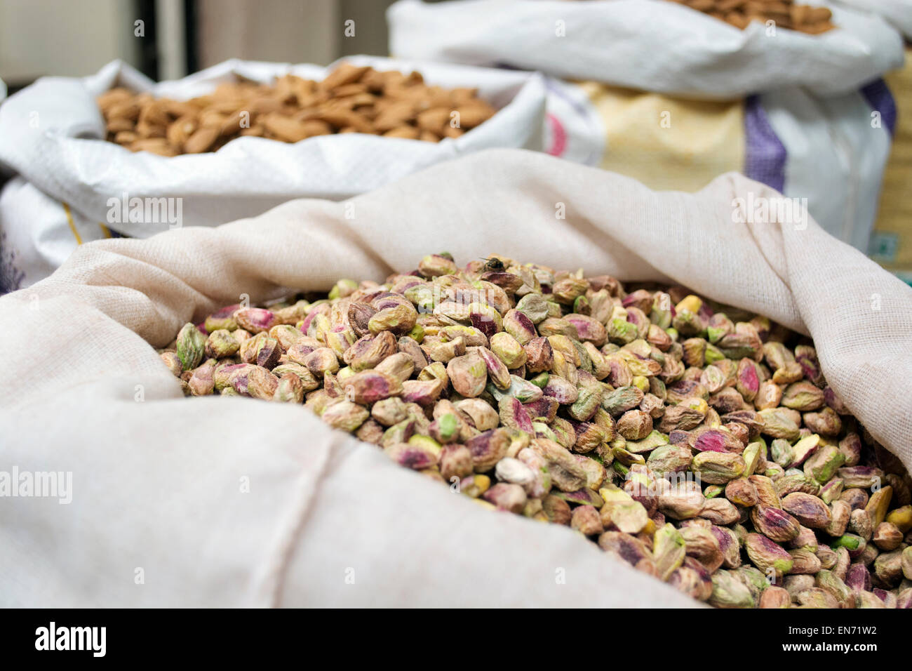 Sack of pistachio nuts and almond for sale at market,India Stock Photo
