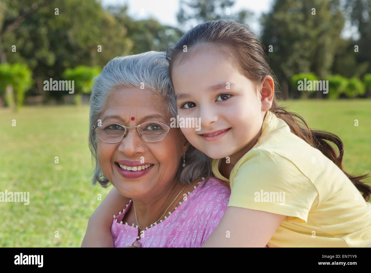 Portrait of grandmother and granddaughter smiling Stock Photo